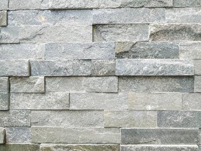 凹凸墙天然材料制成的浅灰色现代石质墙面砖,表面凹凸不平,以达到装饰
