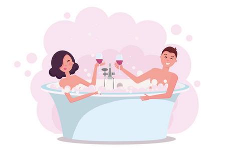 夫妇在洗澡时享受喝红酒.