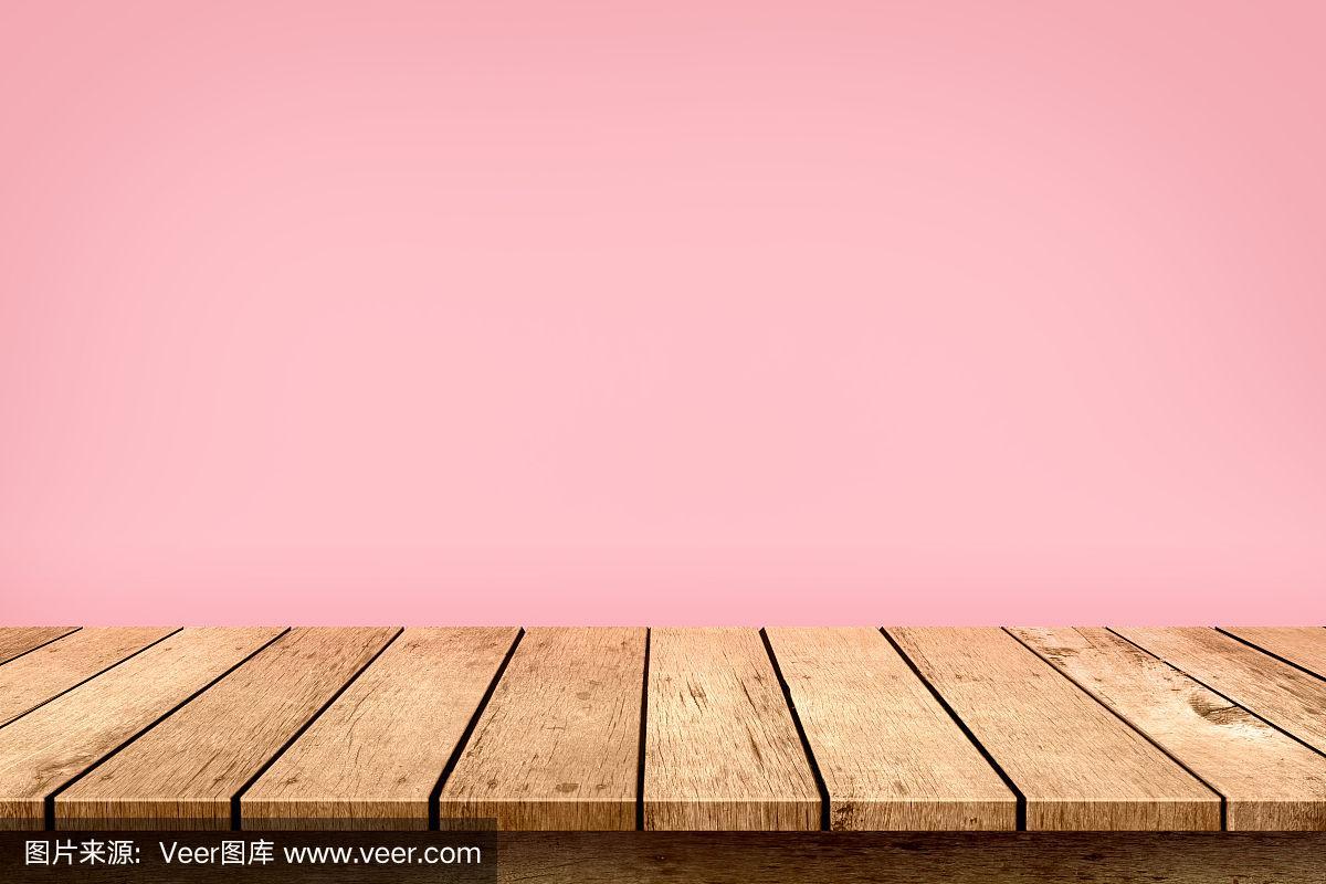 空木质桌面上的粉粉色背景,用于展示或蒙太奇您的产品.
