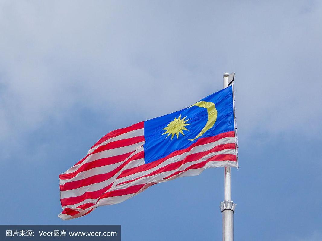 马来西亚-挥舞着马来西亚国旗
